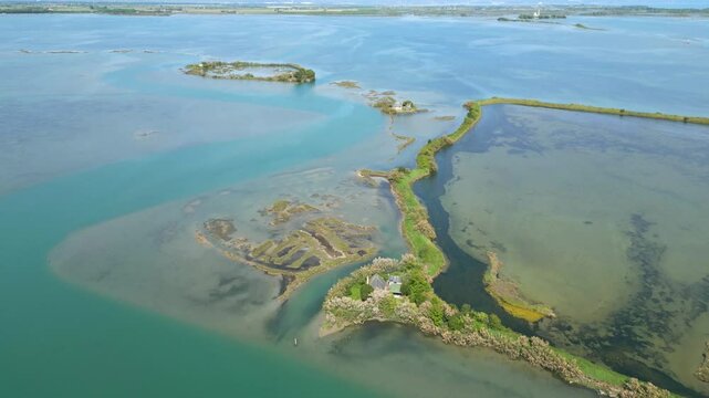 Grado Lagoon seen from above. Between waters, islands and uncontaminated nature