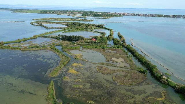 Grado Lagoon seen from above. Between waters, islands and uncontaminated nature