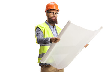 Construction site engineer holding a blueprint and wearing a helmet