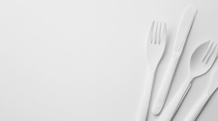 Naklejka premium Realistic white plastic disposable cutlery set consisting of forks and knives isolated on a white background. Perfect for fast food outdoor dining or takeaway visuals.. Generative AI