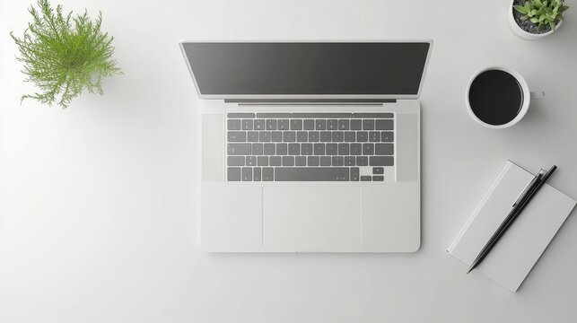 Minimalistic top-down view of a laptop on a white background with a coffee cup notebook pen and a small plant realistic and modern office workspace setup. Generative AI