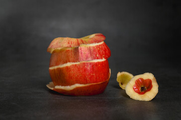 There is no skin on the apple pulp, and the remaining apple skin is a hollow apple.with black background