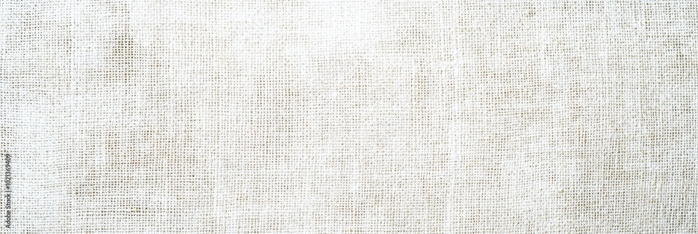 Leinwandbilder the soft, natural linen fabric is elegantly arranged on a wooden surface, showcasing its texture and