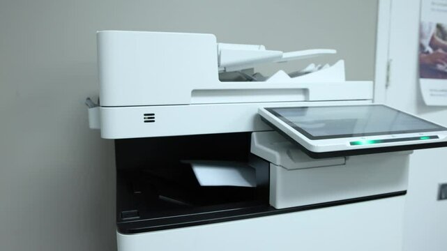 Multifunction printer printing multiple documents in an office setting, quebec, showcasing modern efficiency. Selective focus