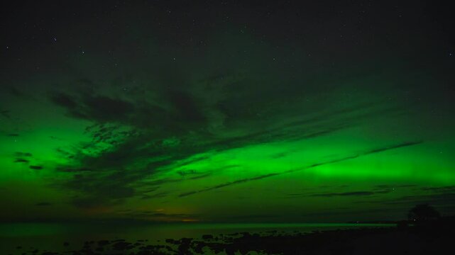 Time lapse Aurora Borealis dancing above the Baltic Sea in Sweden