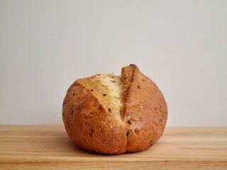 Delicious bread made from wheat flour with flax seeds on a cutting board