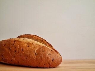 Appetizing bread made from wheat flour with flax seeds on a cutting board