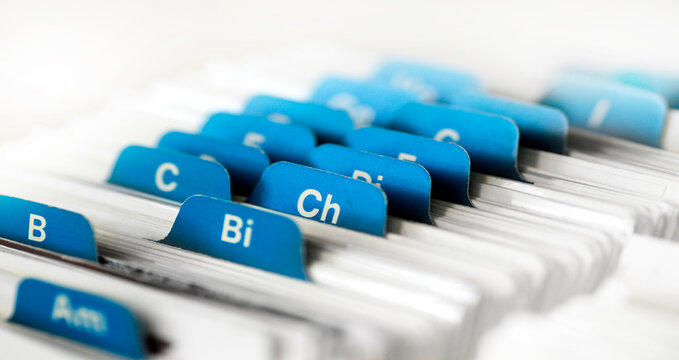 Index cards organized in a row by letter of the alphabet for business contacts and organization for communications with clients