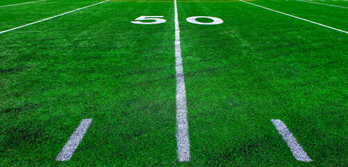 Obraz premium Football Field Green Yard Markers to Goal Line Touchdown Endzone Game Competition 50 Yard Line
