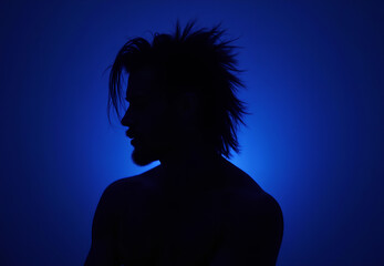 Mysterious Silhouette of a Man in Blue Light