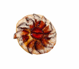 Freshly baked plum tart on a white background
