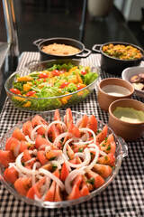 healthy food dish with salad greens vegetables seasoned salad vegan lunch tomato and onion green zucchini