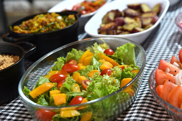 healthy food plate with tropical salad greens vegetables seasoned salad vegan lunch tomato and onion