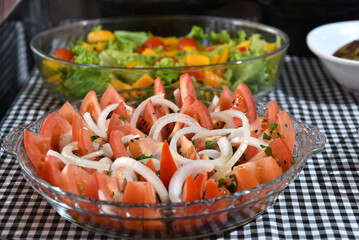 healthy food dish with salad greens vegetables seasoned salad vegan lunch tomato and onion