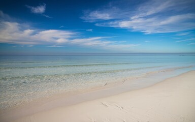 Beach calm water sky. Serene seascape featuring a tranquil beach with clear blue water and a bright sky. Perfect for relaxation and peace.