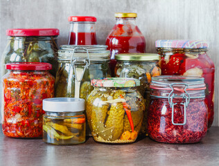 Various kinds preserves vegetables  in glass jars.