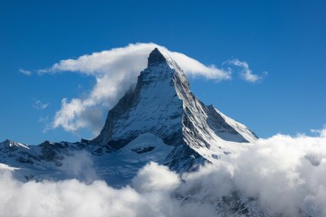 Snowy mountain peak. Majestic mountain peak covered in snow, with clouds swirling around its summit.