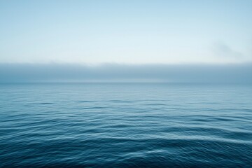 Calm Ocean Surface Under a Foggy Sky