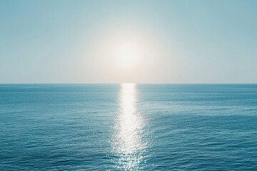 Obraz premium A Calm Ocean Surface with Sun Glare