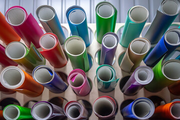 Rolls of self-adhesive film in different shades.Vinyl film for window dressing.