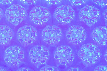 Blue purple abstract wall made from the bottoms of plastic bottles