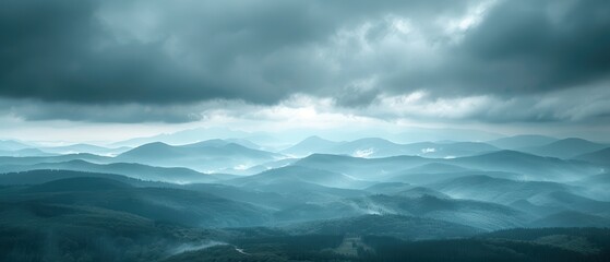 Fototapeta premium Overcast Sky with Rolling Clouds Over Mountains
