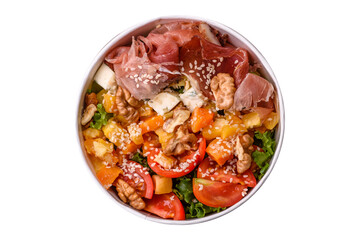 Appetizing salad with prosciutto, pumpkin, cheese and tomatoes