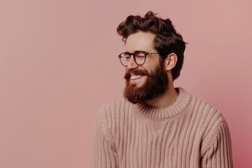 Fototapeta premium Confident young man with beard and glasses smiling happily