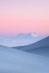 serene, minimalist Antarctic landscape with soft, pastel tones of pink and blue. Snow-covered mountains and gentle slopes create a peaceful, distant view under a clear sky