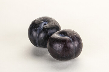 Two ripe sweet black plums