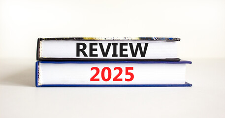 Planning review 2025 new year symbol. Concept words Review 2025 on beautiful books. Beautiful white background. Business review 2025 new year concept. Copy space.