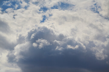 Large white cumulus cloud close-up aerial view