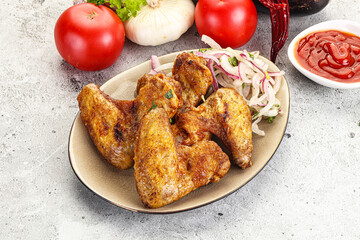 Grilled chicken wings with sauce
