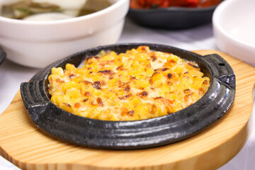Korean sashimi restaurant side dishes. sweet corn cheese