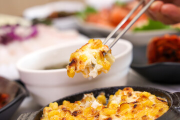 Korean sashimi restaurant side dishes. sweet corn cheese