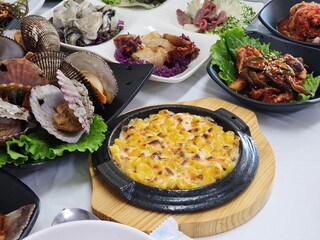 Korean sashimi restaurant side dishes. sweet corn cheese