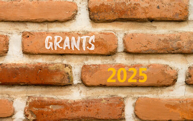 Planning grants 2025 new year symbol. Concept words Grants 2025 on beautiful brown brick wall. Beautiful brown brick wall background. Business grants 2025 new year concept. Copy space.