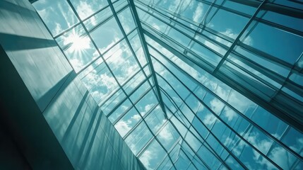 A modern glass skylight with metal framing, casting dynamic light patterns onto the floor of an open atrium