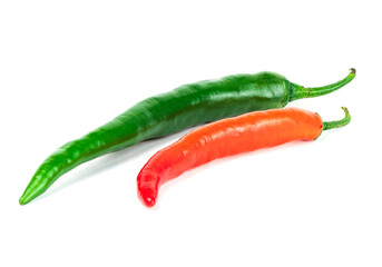 A vibrant display of green and red chili peppers arranged side by side against a clean white backdrop