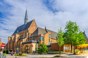 De Romaanse Poort Romanesque Gate building in Leuven city historical center in sunny summer day,...
