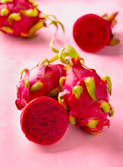 Red dragon fruit, pitahaya. Pink background. Close up.