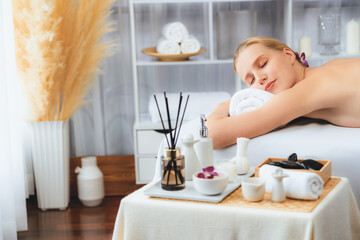 Caucasian woman customer enjoying relaxing anti-stress spa massage and pampering with beauty skin...