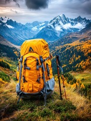 A vibrant yellow backpack rests on a hill, surrounded by stunning mountain landscapes and autumn foliage.