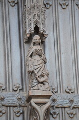 Fototapeta premium Intricate Wooden Sculpture of a Saint on a Gothic Door in Brussels 