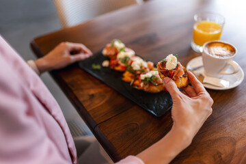 Canape served as appetizer on a gathering in a restaurant. Food and drink concept.