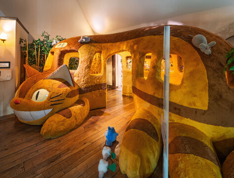 shizuoka, japan - mar 26 2024: Life-size plush toy used as photo spot featuring the giant Neko Bus or Catbus from anime My Neighbor Totoro by Studio Ghibli displayed at the Izu Teddy Bear Museum.