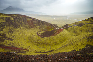 A misty landscape of the Grábrók crater, an extinct volcano in Vesturland, Iceland, with a...