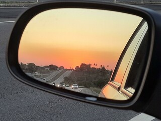 Sunset in the rearview mirror