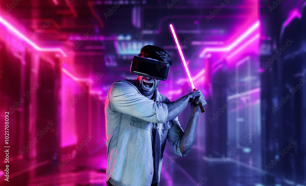 Poster gamer holding laser sword and playing action game while wearing vr glasses. caucasian man using visu