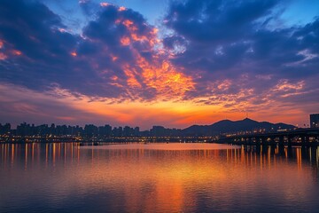Obraz premium a beautiful sunset over a body of water